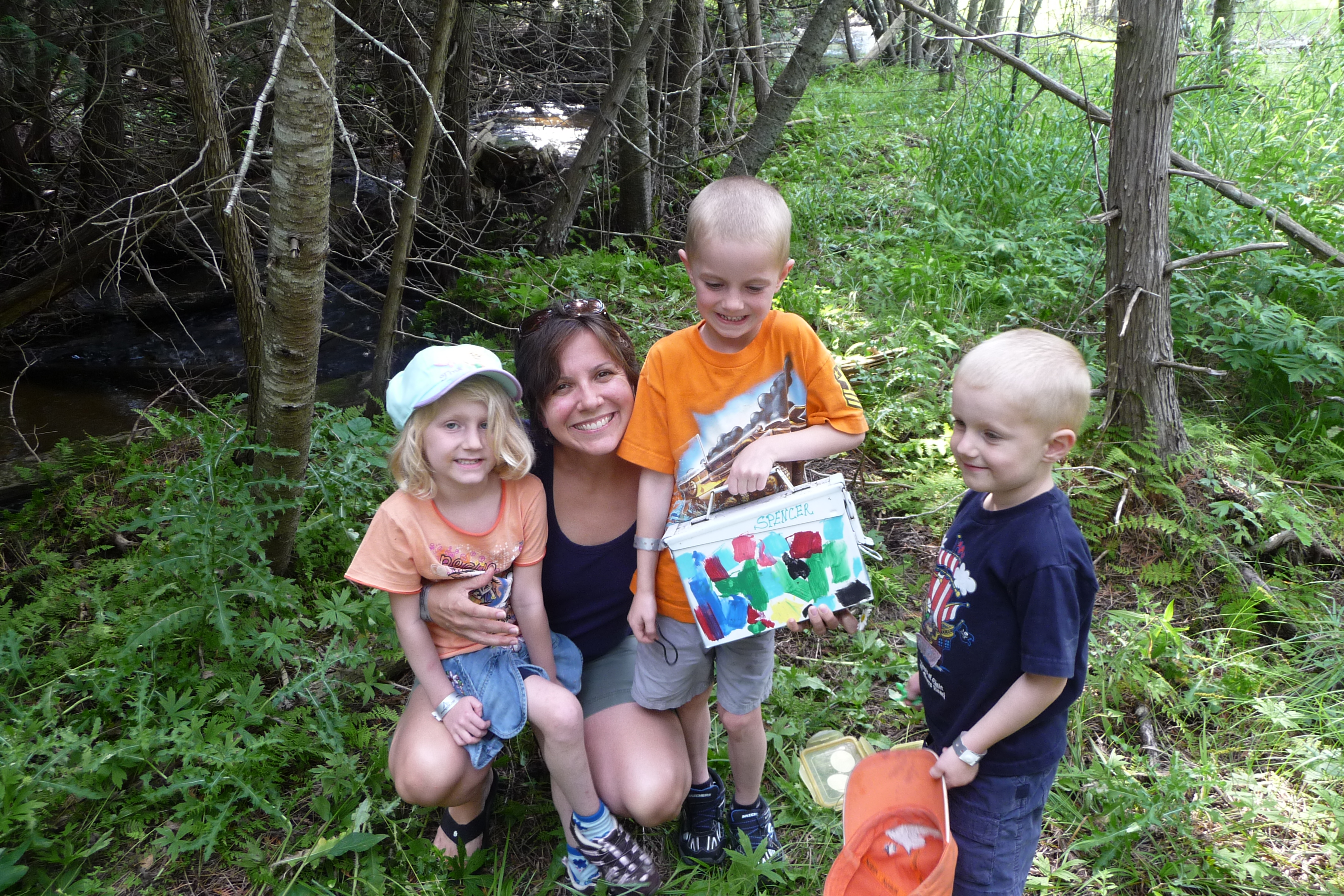 Here are Julie's children and a family friend enjoying a geocache adventure