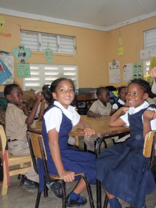 Jamaican children in school uniforms.